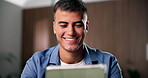 Freelancer, reading and man with tablet, home office or smile for article, reporter and remote work. Happy, journalist and person with tech for magazine publication, editing and project in house