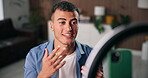 Phone, ring light and streamer with conversation for live stream, content creation and social media in home. Man, influencer and gen z person with tech for broadcast, chat and online interaction
