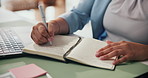 Woman, hands and writing with book for schedule planning, reminder or agenda in office. Female person, employee or taking notes with diary for project ideas, brainstorming or record keeping on desk