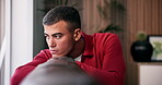 Lonely, man and thinking on couch, house and sad after break up in lounge, memory and mental health. Anxiety, reflection and person with depression, disappointed and heartbroken by toxic relationship