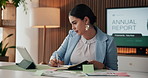 Woman, tablet and writing in notebook in office for stock price info, data comparison or forecasting. Financial analyst, tech or graph documents with sticky note for reporting, budget review or stats