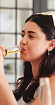 Happy, conversation and woman with alcohol at lunch for social gathering, celebration and reunion. Laugh, friends and person with drinks for hangout on holiday, vacation and weekend together on patio