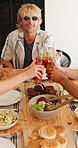 Happy, cheers and friends with drinks at lunch for social gathering, reunion and hangout together. Summer, brunch and people with alcohol, beer and toast for bonding, connection and celebration