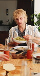 Outdoor, man and lunch with friends at house for social gathering, group or and reunion with cuisine. Home, together and hangout with food on weekend, happy and people with alcohol on break and event