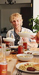 Patio, man and meal with friends at house for social gathering, reunion and sharing food on holiday. Home, together and hangout with lunch on weekend, happy and people with alcohol or outdoor event