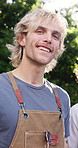Backyard, happy and face of man with friends for social gathering, party and hangout together. Garden, smile and portrait of person outdoor for barbecue for holiday, vacation and reunion on weekend