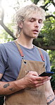 Barbecue, man and reading phone in backyard for online recipe, social gathering and party event. Flare, person and smartphone at cookout in home garden for bbq instructions, grill tutorial or weekend