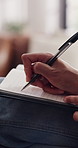 Notebook, writing and hands of person in home for wellness, mental health and reflection. Diary, pen and journal with feelings for self care with agenda planning, schedule or to do list in house.