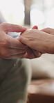 Holding hands, love and couple in home with support, empathy or assurance in relationship. Commitment, comfort and man with woman for connection, bonding and partnership in apartment together.