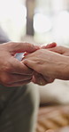 Holding hands, care and couple in home with support, empathy or assurance in relationship. Commitment, comfort and man with woman for connection, bonding and partnership in apartment together.