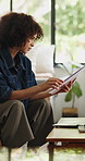 Documents, finance and reading with woman in living room for home budget or income statement. Investment, financial paperwork and savings with person in apartment for banking feedback or report