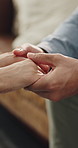 Holding hands, love and people in home with support, empathy or assurance in relationship. Commitment, comfort and man with woman for connection, bonding and partnership in apartment together.