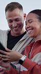 Laughing, athlete and couple with smartphone, outdoor and streaming comedy on social media and break. Online, fitness and interracial people with mobile after workout, happy and funny video on web