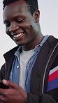 Laughing, phone and typing with black man outdoor for communication or university feedback. Funny, mobile and text message with happy student walking to college for development, learning or study
