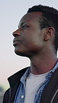 Thinking, serious and black man outdoor with idea for planning, mindset or inspiration on vacation. City, reflection and person with thoughts, profile and daydream while sightseeing on holiday
