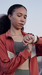 Fitness, smart watch and thinking with woman in city for cardio training, tracking or vision. Buildings, exercise and planning with runner person outdoor in urban town for performance or practice