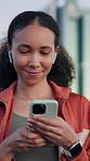 Fitness, phone and woman with earphones in city, streaming service and think of song with smile. Mobile, sports and person outdoor with audio, walking and online search with idea for music playlist
