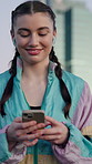 Music, phone and typing with woman outdoor for communication, contact or university feedback. App, earphones and text message with happy student walking to college for development, learning or study