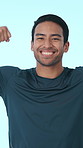 Muscle flex, fitness and face of man in studio with confidence for exercise, strength or health. Happy, portrait and person with pride for bodybuilder, training progress or workout on blue background