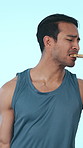 Weights, pizza and man in studio with choice for wellness, eating and exercise for healthy body. Upset, confused and person with bad decision, dumbbells and fast food for exercise on blue background