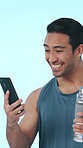 Fitness, phone and success with man in studio for workout goal, social media and gym leaderboard. Health stats, training celebration and online bonus with person in blue background for achievement