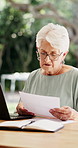 Documents, stress and old woman in home, finance planning or confused with taxes. Savings, loan rejection or senior person in lounge, pc or paperwork for budget review, mortgage invoice or frustrated