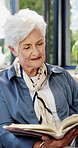 Bible, reading and retirement with old woman in home living room for Christian study or faith. Belief, holy book and religion with senior person in apartment for learning or spiritual knowledge