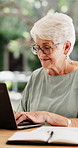Typing, laptop and senior woman in home, pension payout application and elderly grant registration. Reading, computer and old person with online bank clearance for subsidy, smile and retirement funds