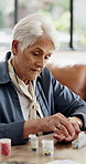 Old woman, pills and container for schedule with prescription drugs, wellness and retirement home. Elderly person, sorting and pharmaceutical product with reminder, organizer and supplements in house