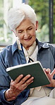 Elderly, woman and tablet in home for reading email, check article or ebook on weekend in retirement. Technology, smile and senior person in living room for online news, scroll blog or relax with app