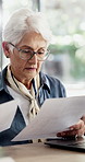 Documents, confused and old woman in home, finance planning or frustrated with taxes. Savings, loan rejection or senior person in lounge, pc or paperwork for budget review, mortgage invoice or stress