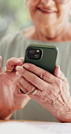 Hands, phone and texting with documents in retirement home with smile, financial review or chat with advisor. Senior person, fintech app and smartphone with admin, contact and pension income at house