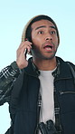 Lost, phone call and man with stress, backpacking or communication with contact for rescue in studio. Blue background, emergency and person with mobile for discussion, worry and talking on adventure