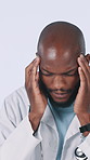 Stress, black man and doctor with headache in studio for fatigue, medical mistake and burnout. Tired, male person and migraine from healthcare crisis, surgery fail and brain fog on white background