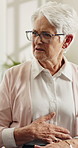 Doctor, consultation and old woman in nursing home with stomach ache, medical problem or complaint. Senior person, talk or explain symptoms in retirement center with abdominal pain, IBS or healthcare