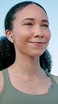 Runner, thinking and woman with earphones in city for exercise, workout and training with music. Fitness, athlete and person with audio, podcast and happy for active hobby, wellness or health in town