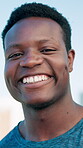 Athlete, face and man with smile on break, fitness and laugh after exercise for wellness and health. Happiness, runner and black person with pride for workout, outdoor or training recovery in Nigeria