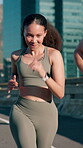 Active friends, woman and running on bridge, fitness and training for marathon in city and together. Outdoor, athlete and people with smile on race, wellness and workout routine for sport tournament