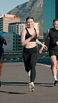 Active friends, group and running on bridge, fitness and training for marathon in city and together. Outdoor, athlete and people with smile on race, diversity and workout routine for sport tournament