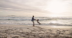 Holding hands, playful and father with son at beach for support, bonding and family holiday. Connection, love and sunset with parent and child outdoor for summer vacation, travel and weekend break