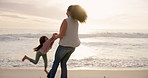 Holding hands, game and mother with daughter at beach for support, bonding and family holiday. Connection, love and sunset with parent and child outdoor for summer vacation, travel and weekend break