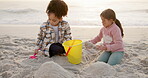 Sandcastle, games and boy and girl at beach for bonding, support and summer vacation. Travel getaway, family holiday and plastic toys with children outdoor for bucket, sand and siblings digging