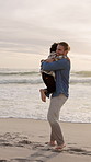 Beach, hug and father with girl, happiness and bonding together for love, vacation and getaway trip. Ocean, family or dad with daughter, people or tropical island for summer holiday, smile or embrace