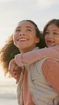 Beach, mother and daughter with piggyback outdoor for bonding, family fun or summer holiday. Love, security and trust with woman carrying girl child on coast for break, getaway or vacation together