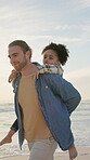 Beach, man and son with piggyback outdoor for bonding, family fun or summer holiday. Love, security and trust with foster dad carrying adopted boy on coast for break, getaway or vacation together