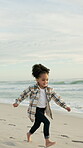 Travel, running and kid at ocean with space, growth and seaside fun on weekend break. Happiness, outdoor vacation and girl at beach with speed, tourist holiday and child development in New Zealand.