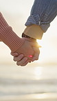 Couple, holding hands and love at beach for travel, adventure and bonding on holiday. Closeup, people and romantic date with partner affection, sightseeing view and weekend break on tropical vacation