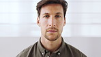 Business, face and serious man on wall background in office for career ambition or development. About us, confidence and professional with employee person in workplace agency for consulting job