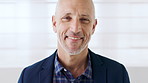 Business, face and smile of mature man on wall background for corporate development or management. Confidence, experience and professional with happy manager in office workplace for career or job