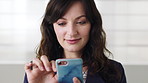 Cellphone, happy and businesswoman by wall in office for email, networking or communication on mobile app. Happy, technology and female employee with phone for online contact in workplace by space.
